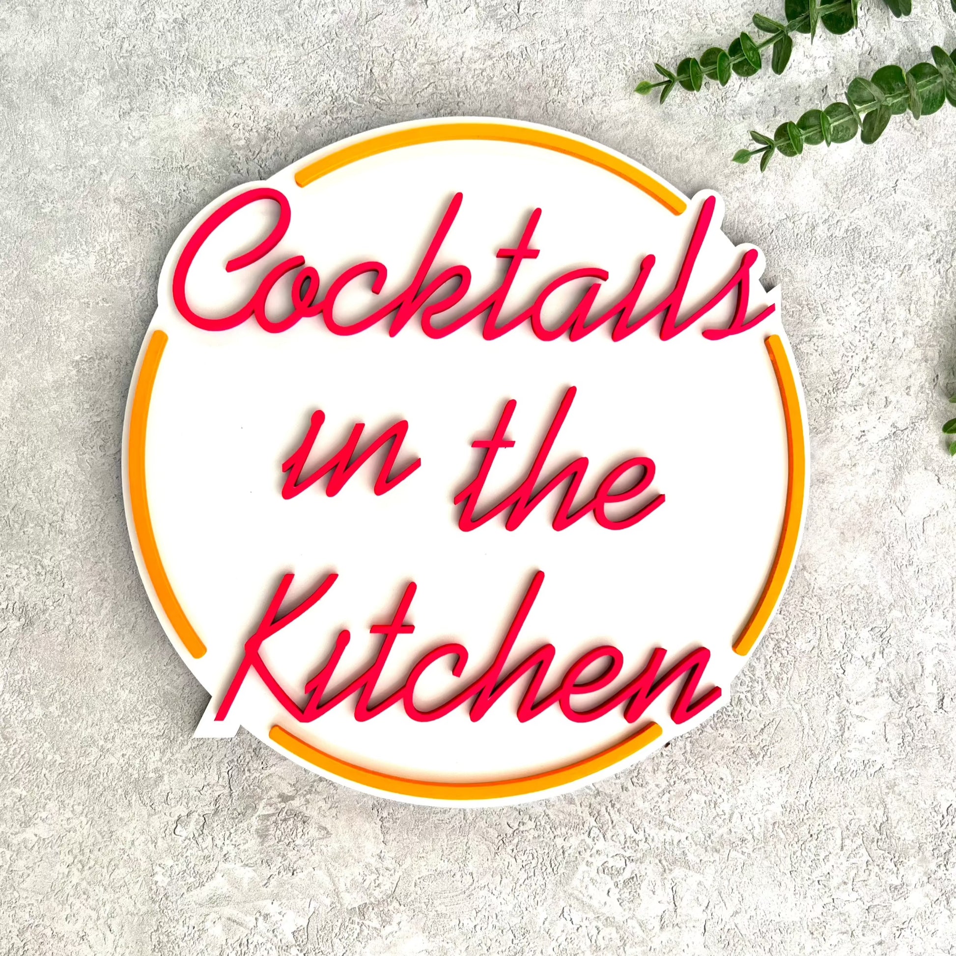 Cocktails in the kitchen sign in white, fluorescent orange & fluorescent pink