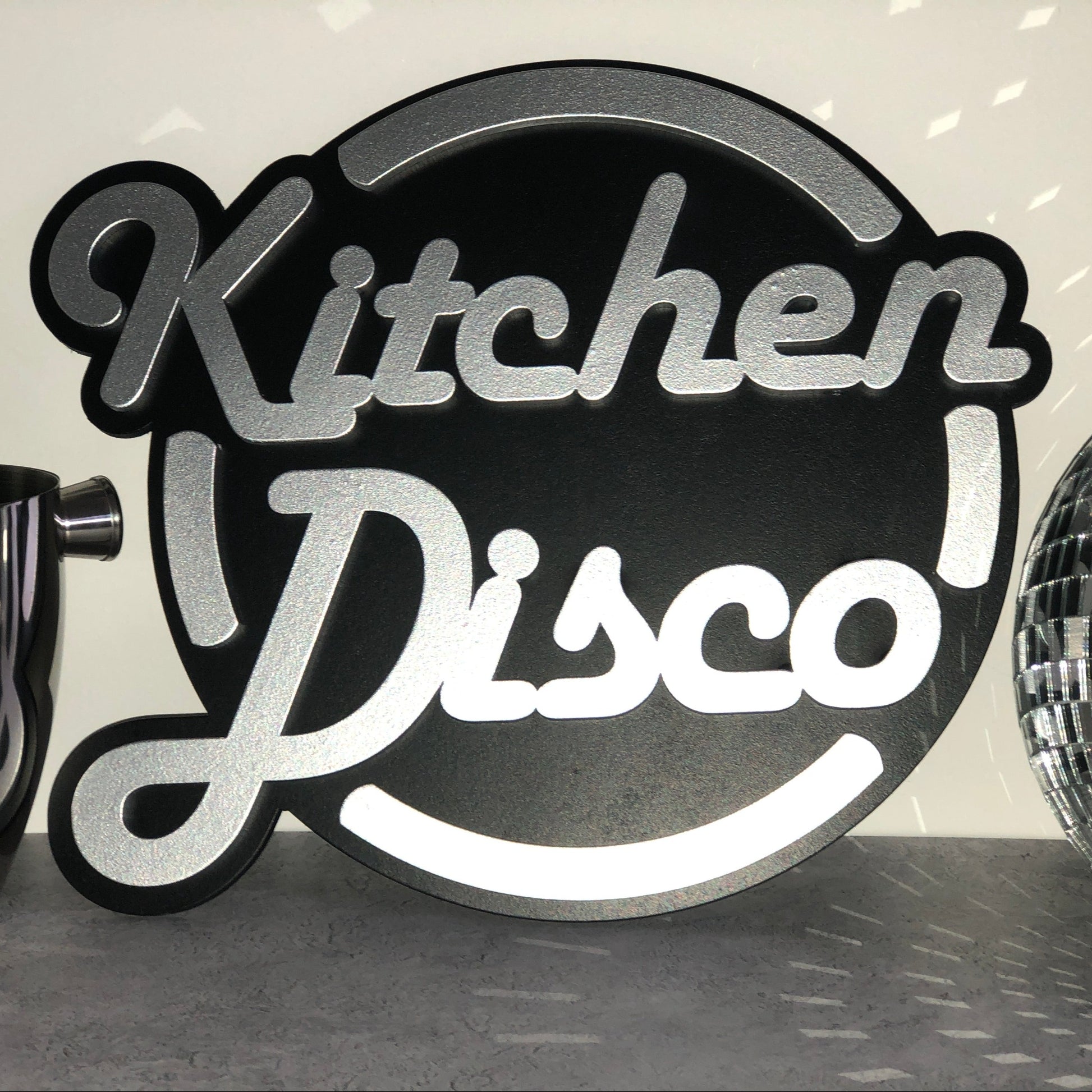 Kitchen Disco sign in black and silver