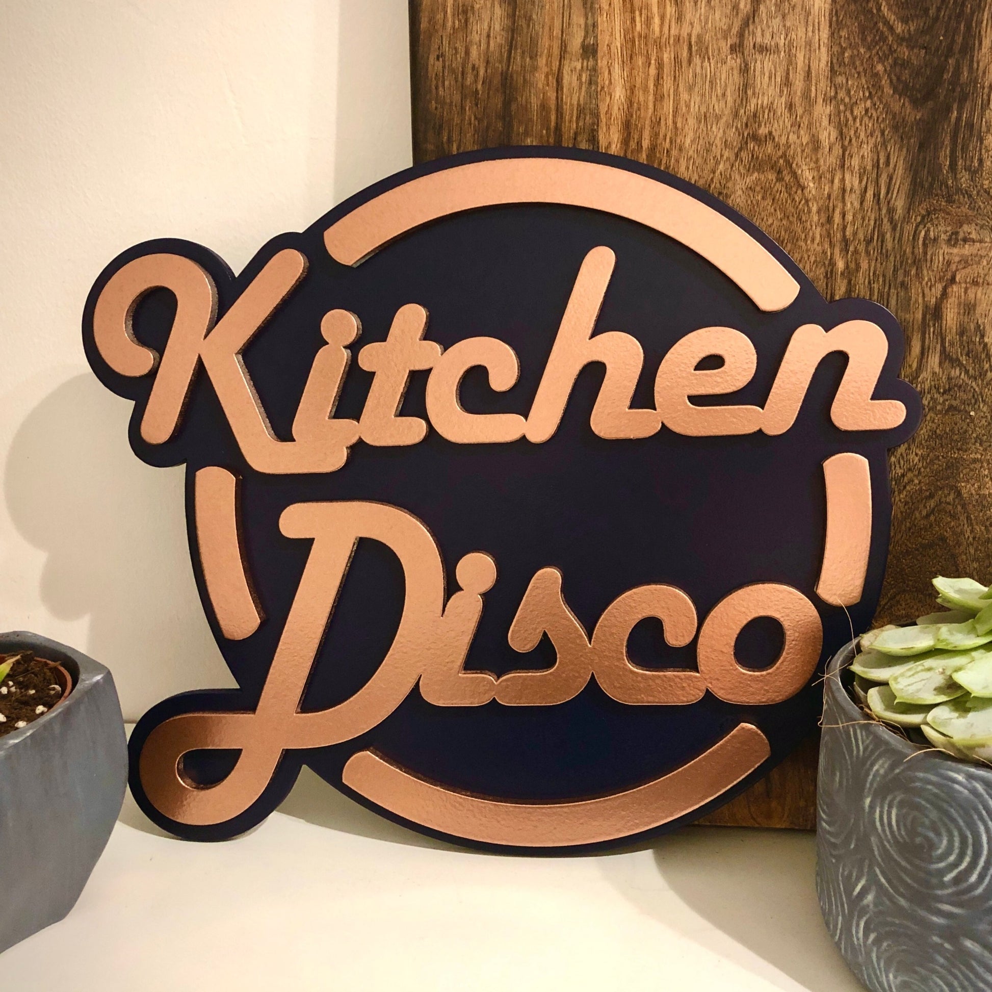 Kitchen Disco sign in black and copper